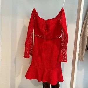 Red mini dress with long sleeves.